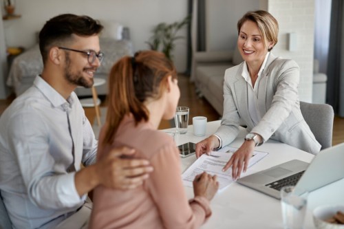 happy-real-estate-agent-having-meeting-with-young-couple-and-pointing-at-place-of-signature-on-their-contract-1-1024x683.jpg